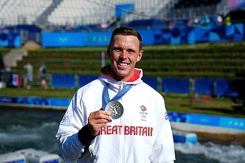 Men's slalom kayak cross medal ceremony: Silver medalist Joseph Clarke of Britain